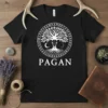 Black t-shirt with white Pagan Tree of Life design featuring runes, crescent moons, and skull, with the word PAGAN below