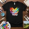 T-shirt with "Paint all the things" text inside a rainbow heart brushstroke design, featuring a palette symbol