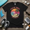 Palm Tree Productions Red t-shirt with retro circular graphic featuring a palm tree, wave, skate ramp, and skateboard