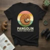 Pangolin curled in a circle with "Pangolin Protect What You Love" text below, vintage sunset design
