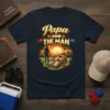 Papa AND THE MAN t-shirt design with cornhole game, sunset, and silhouette of a man