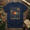 Navy t-shirt with "Paradise Awaits" text below a graphic of a Bird of Paradise flower and two flying birds