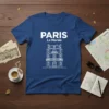 Paris Le Marais text and illustration of a traditional Parisian building on a blue t-shirt