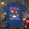 Party in THE USA t-shirt design with an American eagle, fireworks, balloons, and patriotic flag elements
