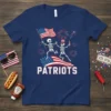 Patriots Skeleton T-Shirt design with two dancing skeletons holding American flags, fireworks, and the word PATRIOTS