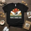 Paw & Hand Love t-shirt design with hands holding a paw print inside a sunset circle