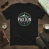 Paxton Mountain Adventure T-Shirt featuring a green circular logo with mountains and the name Paxton, perfect for outdoor explorers