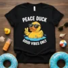 Peace Duck Good Vibes Only text on black t-shirt with cartoon duck wearing sunglasses in water