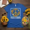 Peace & Flowers text with a sunflower peace sign graphic on a royal blue t-shirt