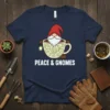 Peace & Gnomes text with a cute gnome sitting in a teacup, navy t-shirt design