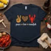 Peace Love Crawfish T-Shirt with peace sign, leopard heart, and red crawfish graphic. Text reads "peace love crawfish"