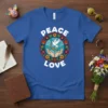 Peace Love t-shirt with a white dove holding a rainbow over cupped hands, surrounded by flowers