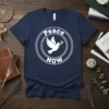Navy blue t-shirt with white "Peace NOW" text and dove graphic inside a circle