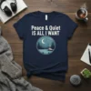 Navy t-shirt with white text "Peace & Quiet IS ALL I WANT" above a circular graphic of a cabin by