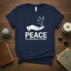 Peace The Universal Symbol T-Shirt with a white dove flying from an open hand, symbolizing peace and harmony