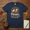 Pecans: Nature's Way Of Showing Off quote t-shirt with illustration of pecans in a nest, navy blue tee