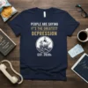 Navy t-shirt with bold white text "PEOPLE ARE SAYING IT'S THE GREATEST DEPRESSION EST. 2020s" and a ship graphic