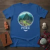 Blue t-shirt featuring a circular graphic of Machu Picchu with "PERÚ" text and a bird symbol below