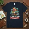 T-shirt design with "Pets & Stories Adventures Await!" text and a whimsical treehouse filled with cats and books