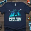 Pew Pew Madafamas! t-shirt with a cartoon cat character holding two guns, set against a city skyline graphic