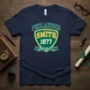 Navy blue t-shirt featuring the Philander Smith 1877 University crest in green and gold with distressed lettering