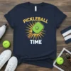 Navy t-shirt with yellow text "PICKLEBALL TIME" and a green pickleball paddle graphic