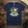 Pig on Dragon Flying High text design on a navy blue t-shirt featuring a cartoon pig riding a green dragon