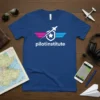 Pilot Institute Aviation Academy logo on a royal blue t-shirt, featuring wings and a plane graphic