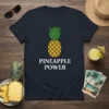 Pineapple Power text with a graphic of a whole pineapple on a navy t-shirt