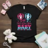 Gender reveal t-shirt with text "Pink or Blue We Love You BABY" and hot air balloon graphics in pink and