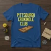 Pittsburgh Crokinole Club text on a blue t-shirt with a graphic of a crokinole board and discs