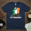 Pittsburgh Ireland Flag Skyline T-Shirt featuring the Irish flag within the outline of Ireland above a Pittsburgh cityscape graphic