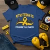 Blue t-shirt with "Pittsburgh is Stronger Than Cancer" text, yellow ribbon, and Pittsburgh skyline graphic