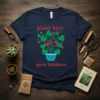Navy blue t-shirt with "plant love grow kindness" text and a cartoon potted plant with heart leaves