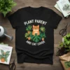 Plant Parent And Cat Lover text with a cute cat surrounded by plants on a black t-shirt