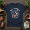 Plant & Purr Parents Urban Jungle Lovers T-Shirt featuring a sleeping cat surrounded by potted plants and decorative text