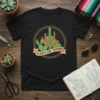 Black t-shirt with a circular design featuring various cacti and the text "PLANTS ARE FRIENDS" on a banner