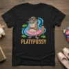 PLATYPUSSY T-Shirt featuring a cartoon platypus wearing glasses and a pink tutu, surrounded by water and lily pads