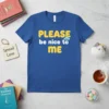 Blue t-shirt with yellow and white text "PLEASE be nice to ME" and a small blue cloud graphic, primary keyword