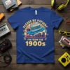 T-shirt with "Please Be Patient I'm From The 1900s" text, cassette on skateboard graphic, retro city background, vintage vibe