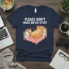 T-shirt with the text "PLEASE DON'T MAKE ME DO STUFF" and a cartoon orange cat lounging in bed holding a