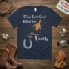 Navy t-shirt with white text "Please Don't Stand Behind Me, I Kick- Heavily" and a graphic of a brown horse
