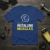 Please Wait: Installing Muscles funny gym workout quote on a blue t-shirt