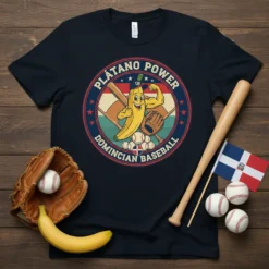 Plátano Power Dominican Baseball t-shirt featuring a muscular banana character in baseball gear, with baseballs and Dominican flag elements