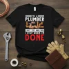 Plumber quote "I Don't Stop When Tired I Stop When I'm Done" with muscular arm holding wrench on black t-shirt