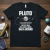 Pluto is like a crazy relative quote t-shirt design with planet graphic and orbits, black tee