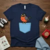 Cute robin bird design peeking out of a light blue pocket on a navy t-shirt. Primary keyword: Pocket Robin Bird