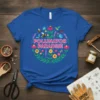 Pollinator Paradise T-Shirt with floral wreath, bees, and hummingbird graphic design