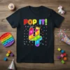 Pop It I am 4 birthday t-shirt with colorful pop it number 4 and text "POP IT! I am 4"