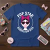 Pop Star Bubbelgum Diva text with graphic of a girl with heart sunglasses and pink bow on a blue t-shirt